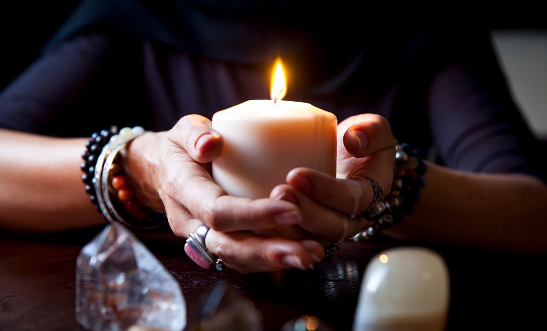 hands holding a candle